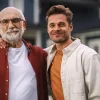 Father and son in front of a home that was bought using a non-arm's length transaction.