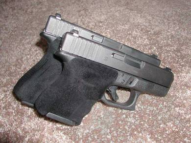 Agrip on two Glock pistols