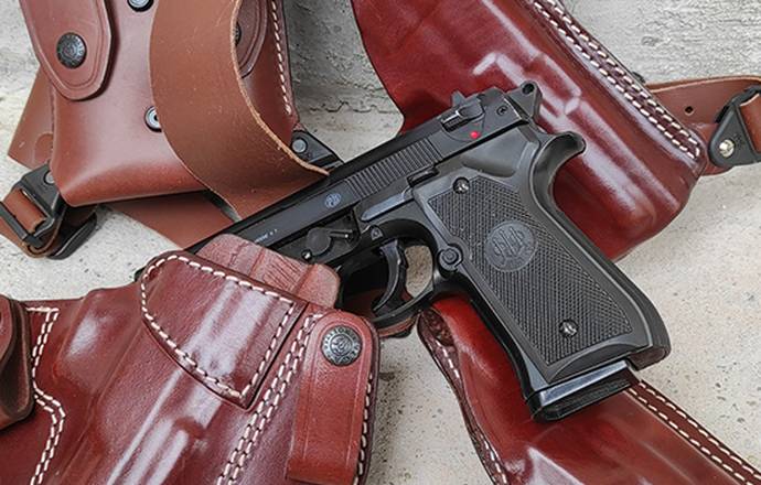 Beretta 92FS semi auto pistol and 3 leather holsters