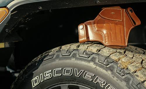 A leather holster on a tyre