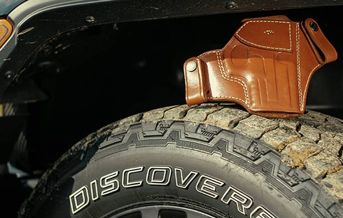 A leather holster on a tyre