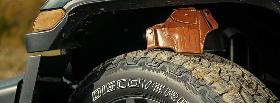 A leather holster on a tyre