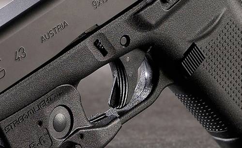 Glock 43 pistol with streamlight tlr 6 light