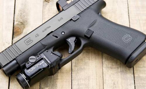 glock 48 with a streamlight tac light attached