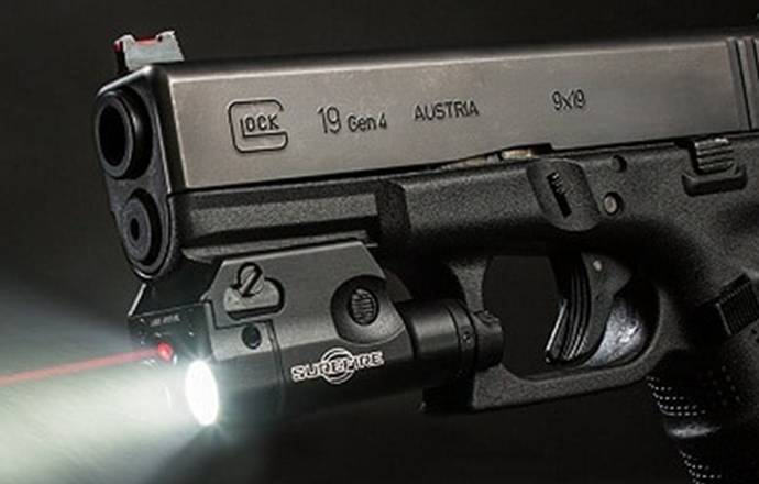 Glock 19 with a tactical light and laser equipped