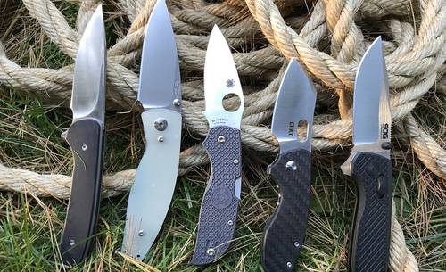 5 EDC knives on grass and ropes