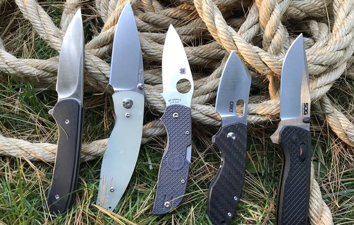 5 EDC knives on grass and ropes