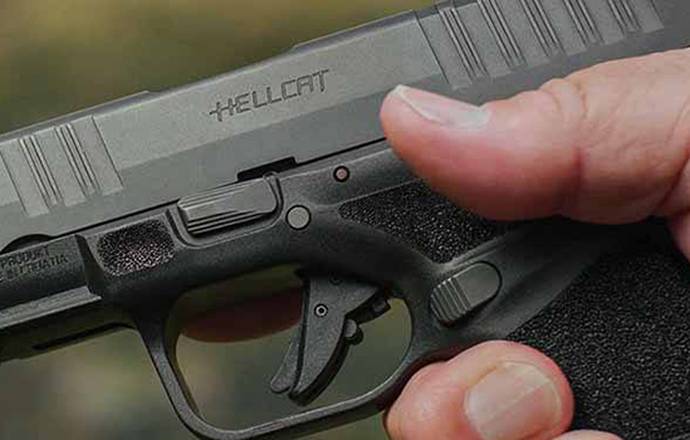 A springfield Armory Hellcat pistol in hands