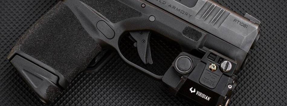 Springfield Armory Hellcat pistol with a flashlight mounted on