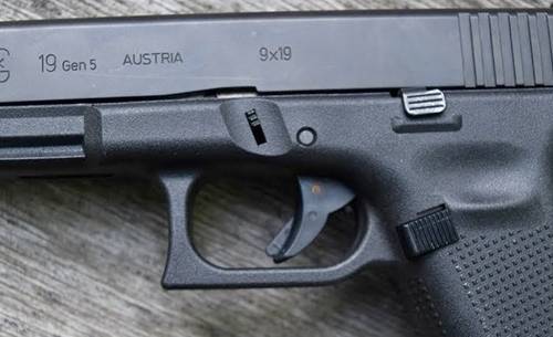 Glock 19 gen 5 lying on a table