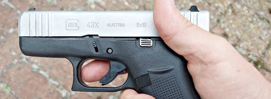 A guy holding Glock 43x Pistol in hand