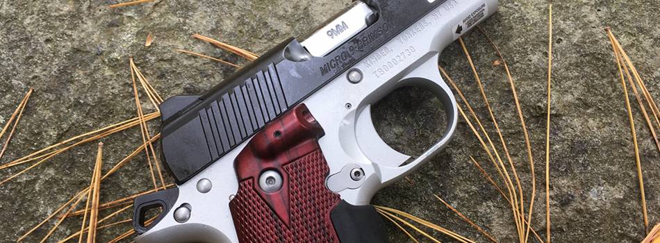 Kimber micro 9 pistol with laser grips