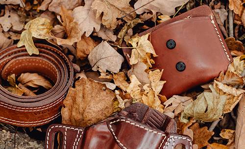 leather magazine pouch and a leather belt and holste