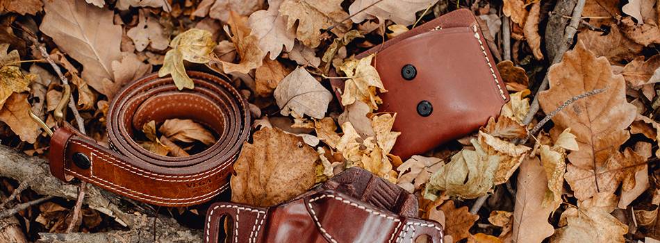 leather magazine pouch and a leather belt and holste