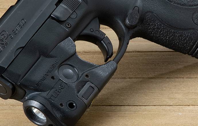 Smith & Wesson M&P9 Shield pistol with a light attached