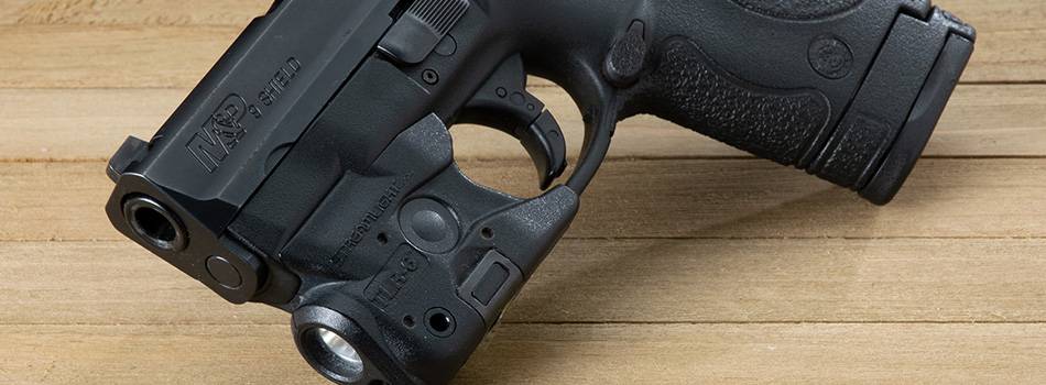 Smith & Wesson M&P9 Shield pistol with a light attached