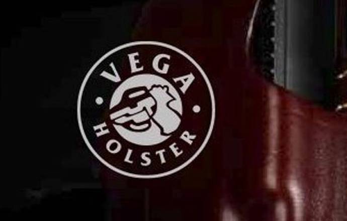 Logo of Vega Holster company on a black background