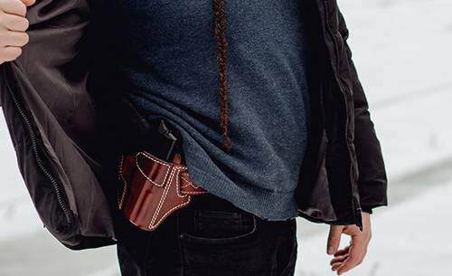 a guy with an owb holster for concealed carry