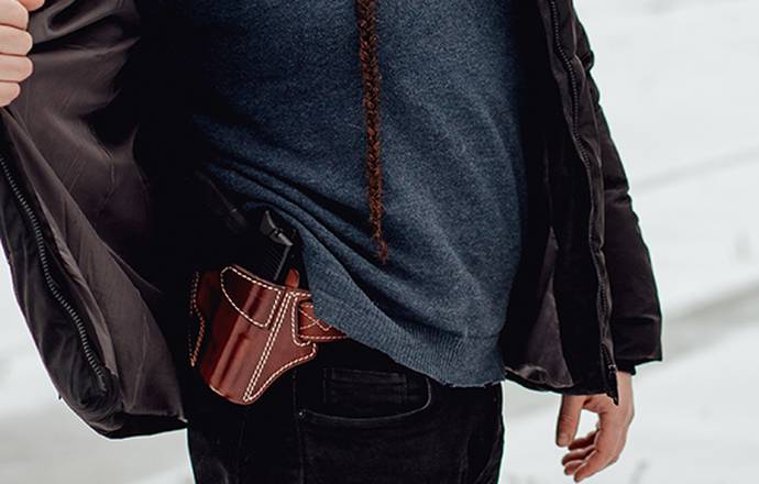 a guy with an owb holster for concealed carry