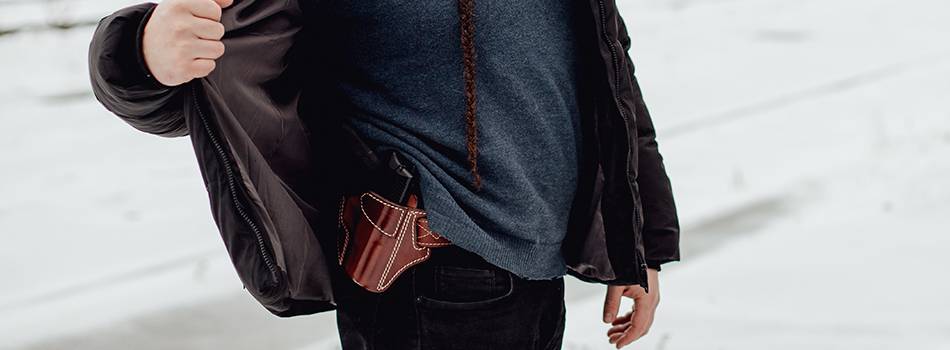 a guy with an owb holster for concealed carry