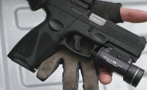 Taurus G3c pistol with a tactical light mounted to its rail