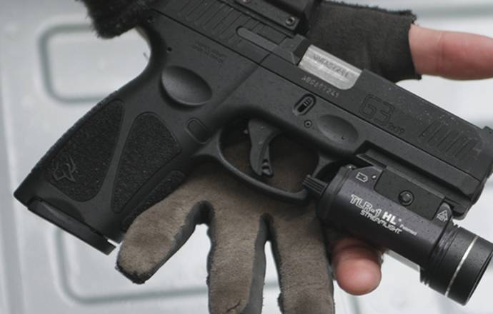 Taurus G3c pistol with a tactical light mounted to its rail