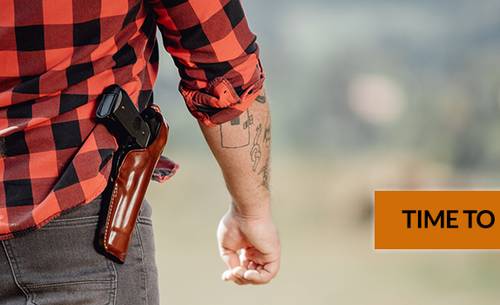 a guy in a flannel shirt with a custom leather holster and a semi automatic pistol