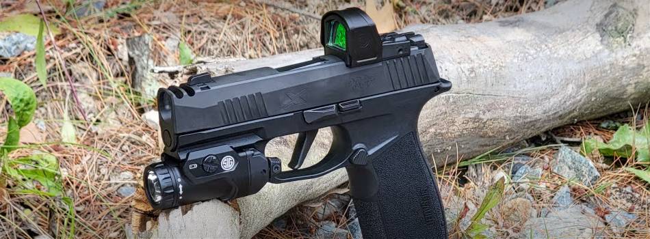 SIG Sauer p365-xmacro pistol with a red dot sight and tactical light attached