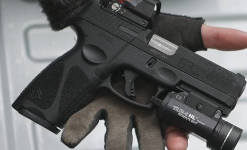 Taurus G3c pistol with a streamlight tlr-1 tactical light and laser combo