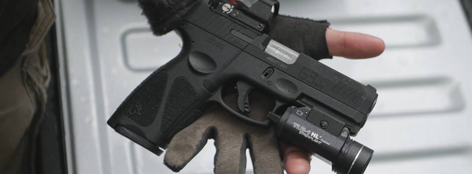 Taurus G3c pistol with a streamlight tlr-1 tactical light and laser combo