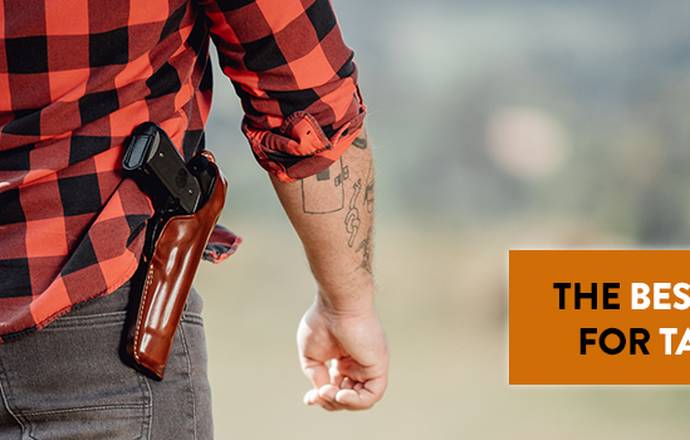 A guy in a checkered flannel shirt with an OWB Taurus G3c leather holster