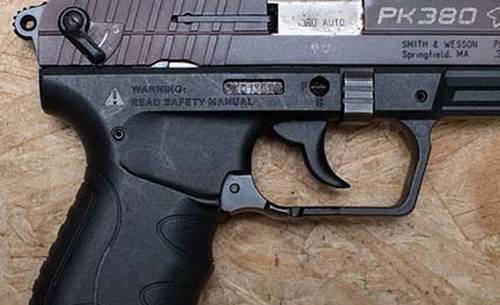 Walther PK380 review - title picture showing Walther PK380 on a wooden backround