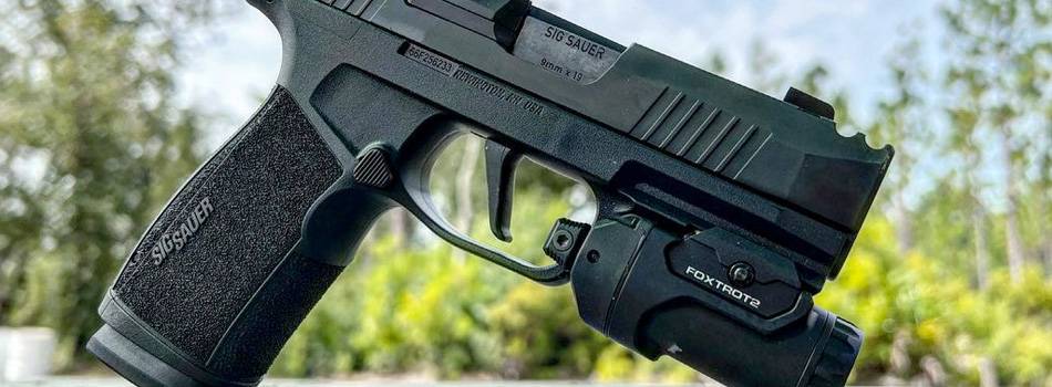 SIG Sauer p365-Xmacro pistol with a tactical light mounted to its rail