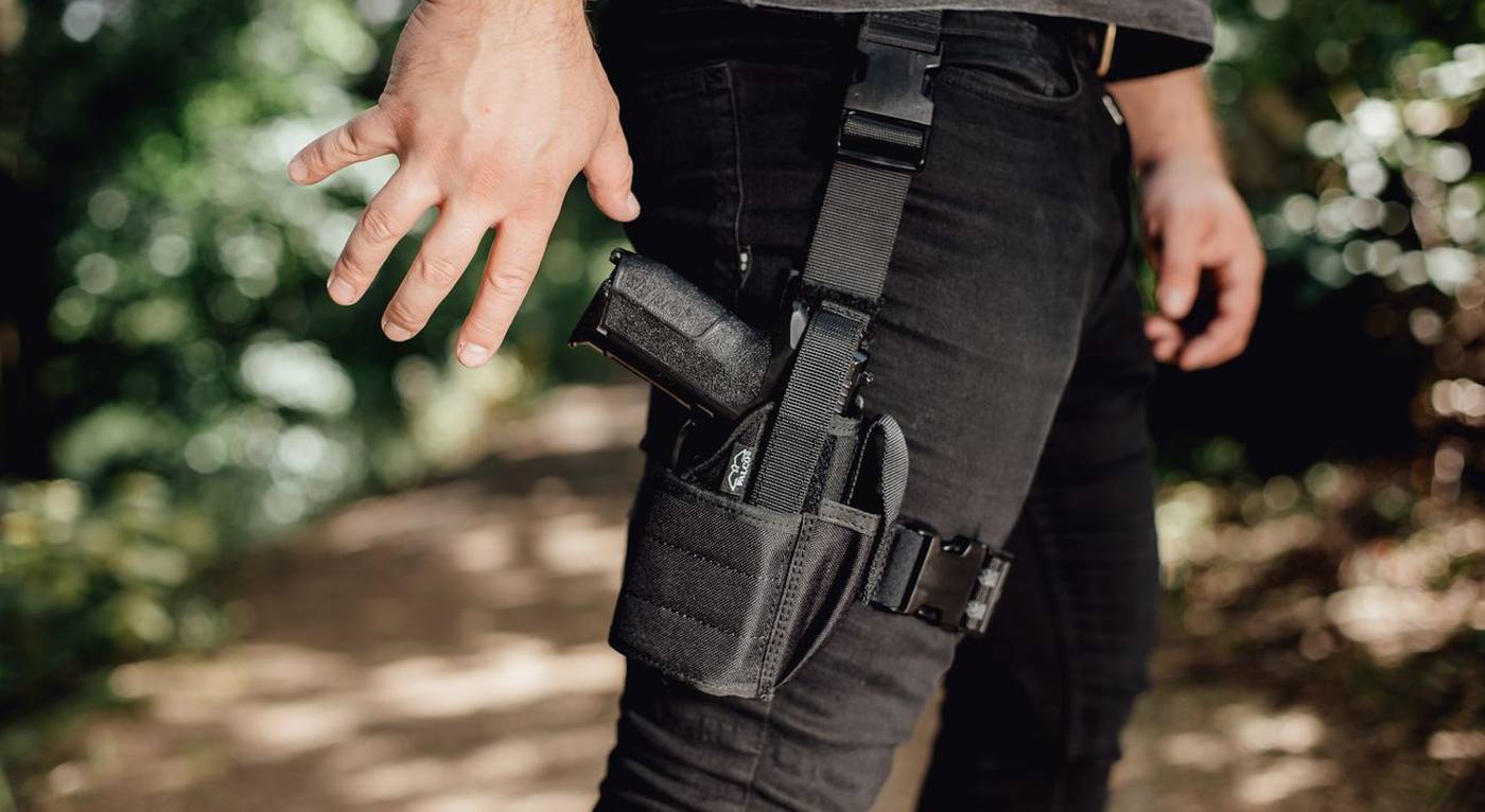 https://storage.googleapis.com/craftholsters-2019/__sized_fe_2021__/product_images/drop-leg-holster-for-gun-w-light-7-lib0--crop-c0-5__0-5-1400x766-70.jpg