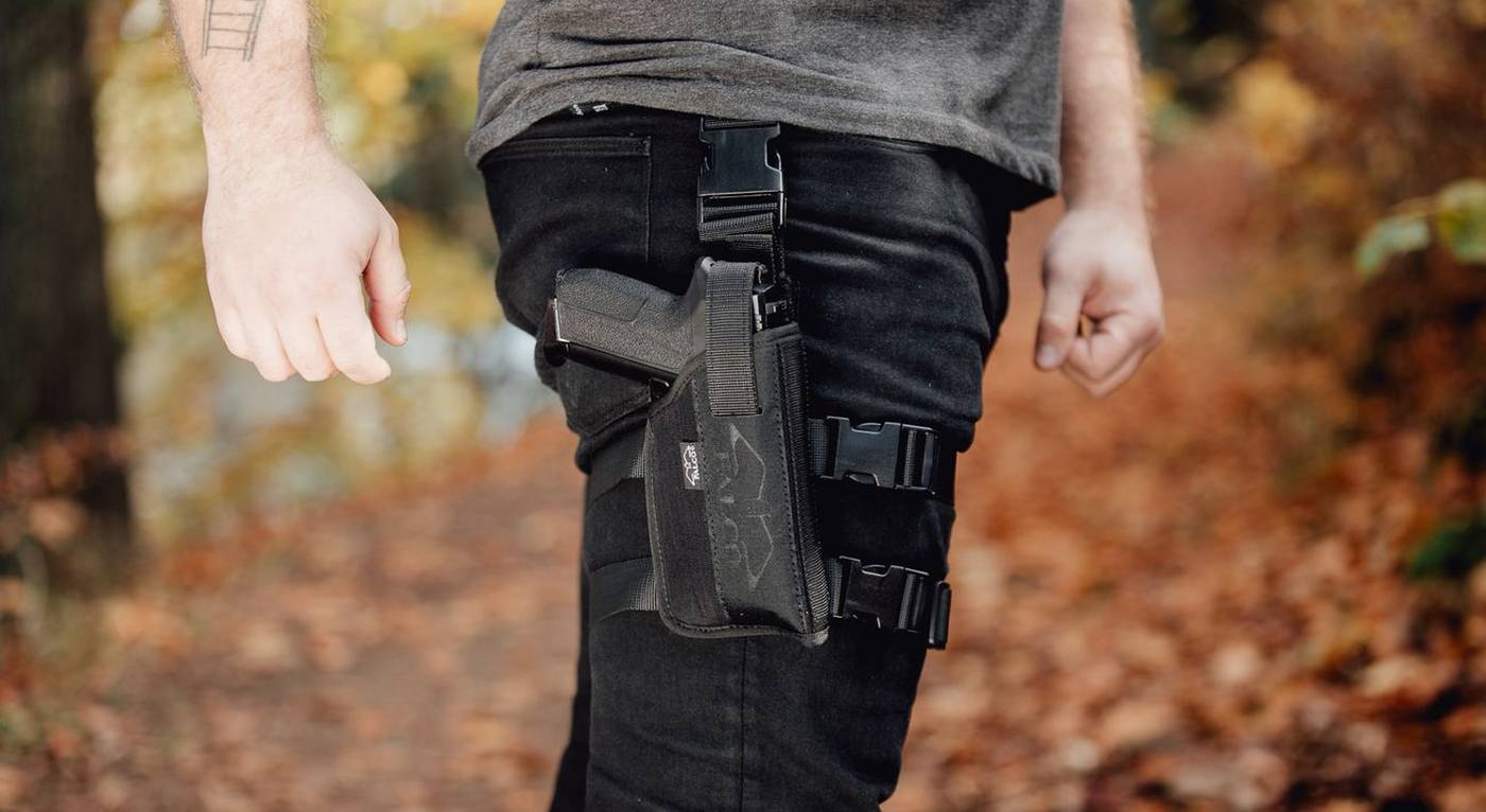 https://storage.googleapis.com/craftholsters-2019/__sized_fe_2021__/product_images/drop-leg-nylon-holster-for-gun-w-light-3-emsu--crop-c0-5__0-5-1400x766-70.jpg