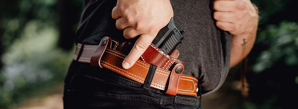 a guy drawing from his inside the waistband holster