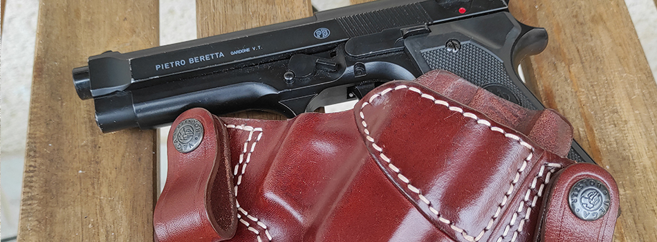 beretta 92 fs pistol and iwb leather holster