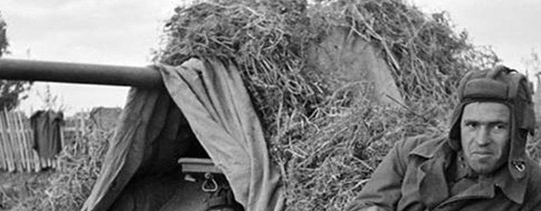 two soldiers near a T34 tank