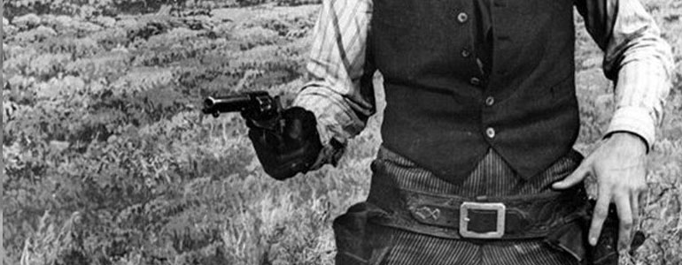 A man pointing a revolver at someone