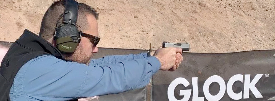 A guy shooting from his glock 43x on the range