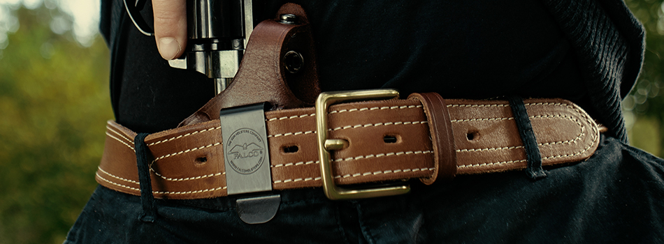 A revolver being holstered into an IWB holster