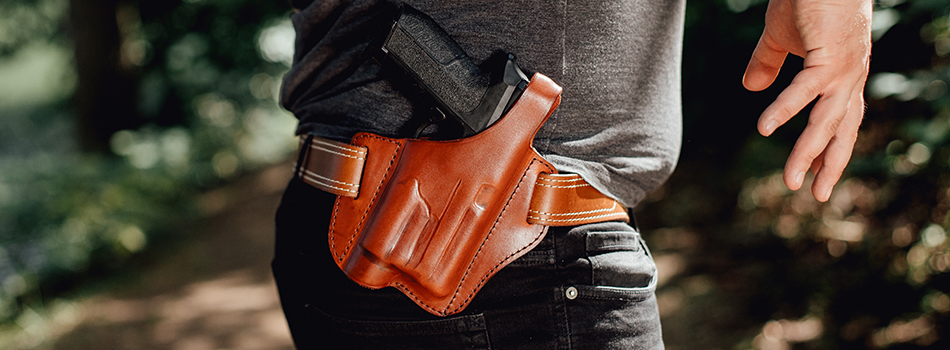 a guy wearing a light bearing holster