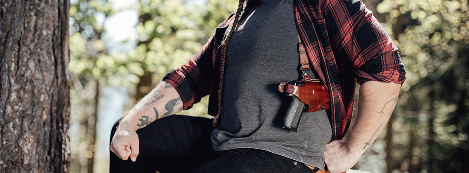 A guy with a shoulder holster and gun