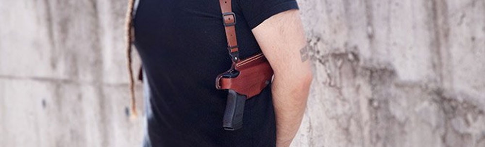 Man carrying his handgun in a shoulder holster