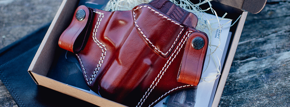 a leather holster in a box