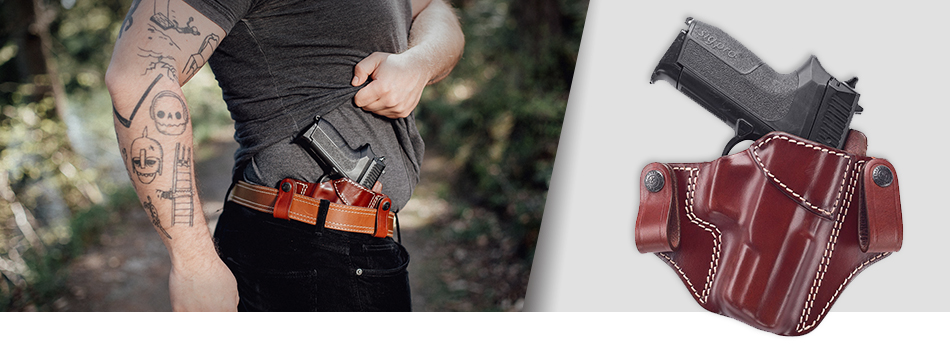 A guy showing his inside the waistband concealed carry leather holster tucked under a shirt