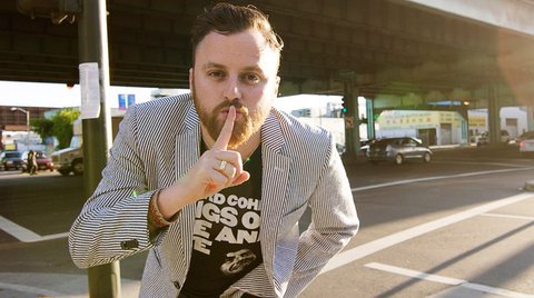 Stuart Schuffman with his hand over his lips