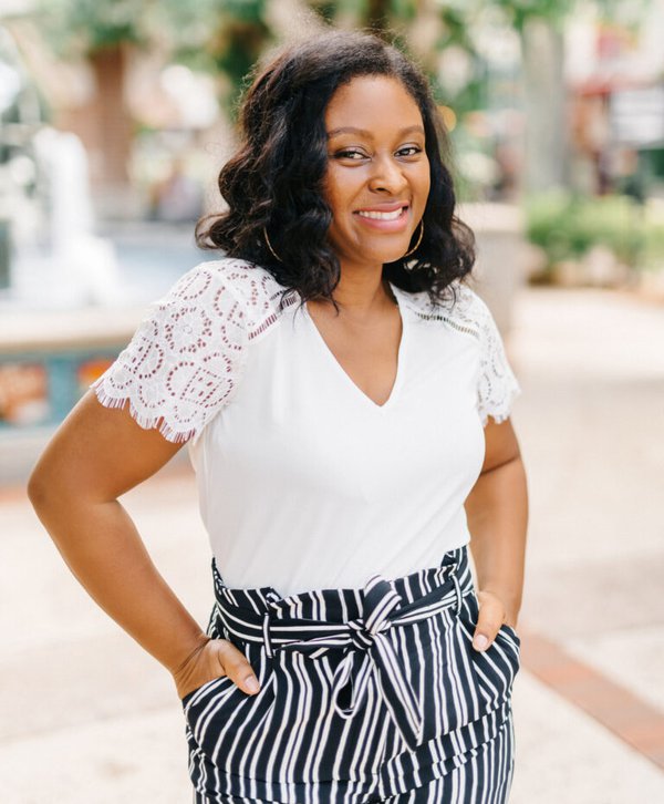 Nakisha Wynn standing with her hands in her pockets