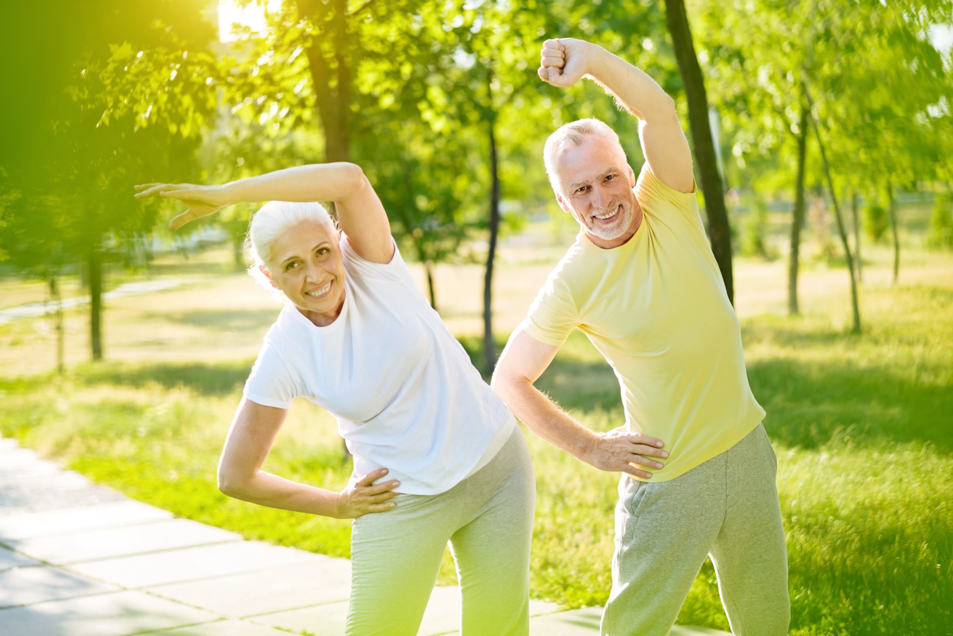 Happy senior couple exercising outside