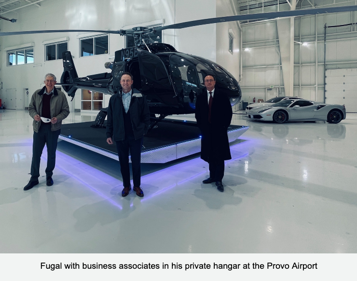 Fugal with business associates in his private hangar at the Provo Airport